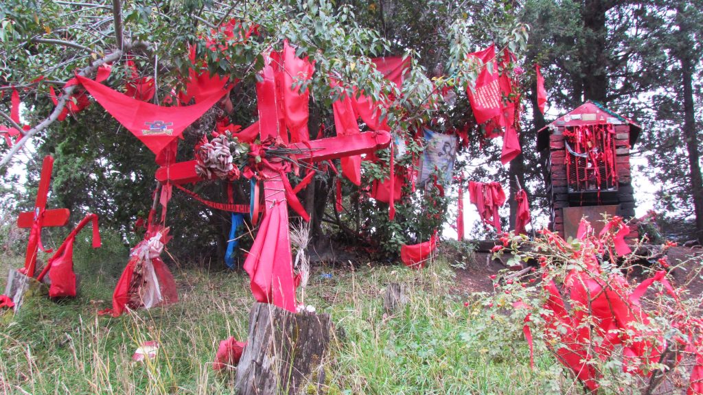 Flags surrounding a shrine near San Martin de los Andes, Argentina.