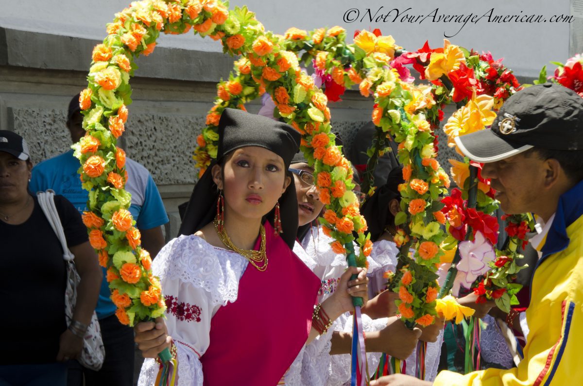 Quiteña waiting for her turn on stage, Palm Sunday, Quito | ©Angela Drake