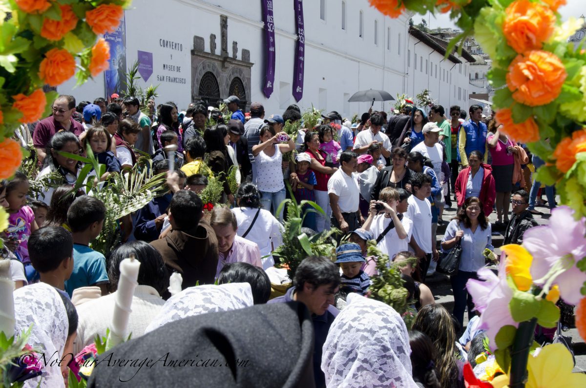 A priest blesses the crowd with holy water; San Francisco Plaza, Quito, Ecuador | ©Angela Drake