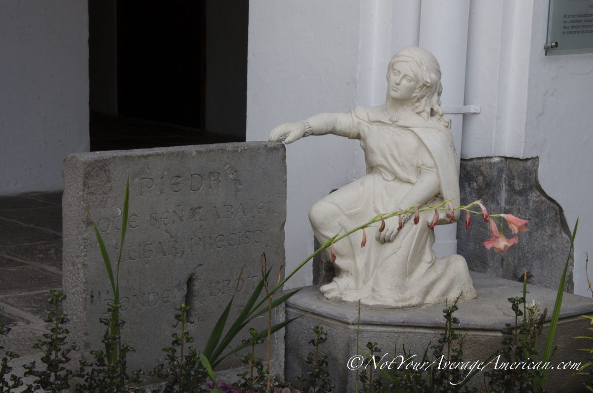 A small statue in the inner courtyard; Museo de Carmen Alto, Quito, Ecuador | ©Angela Drake