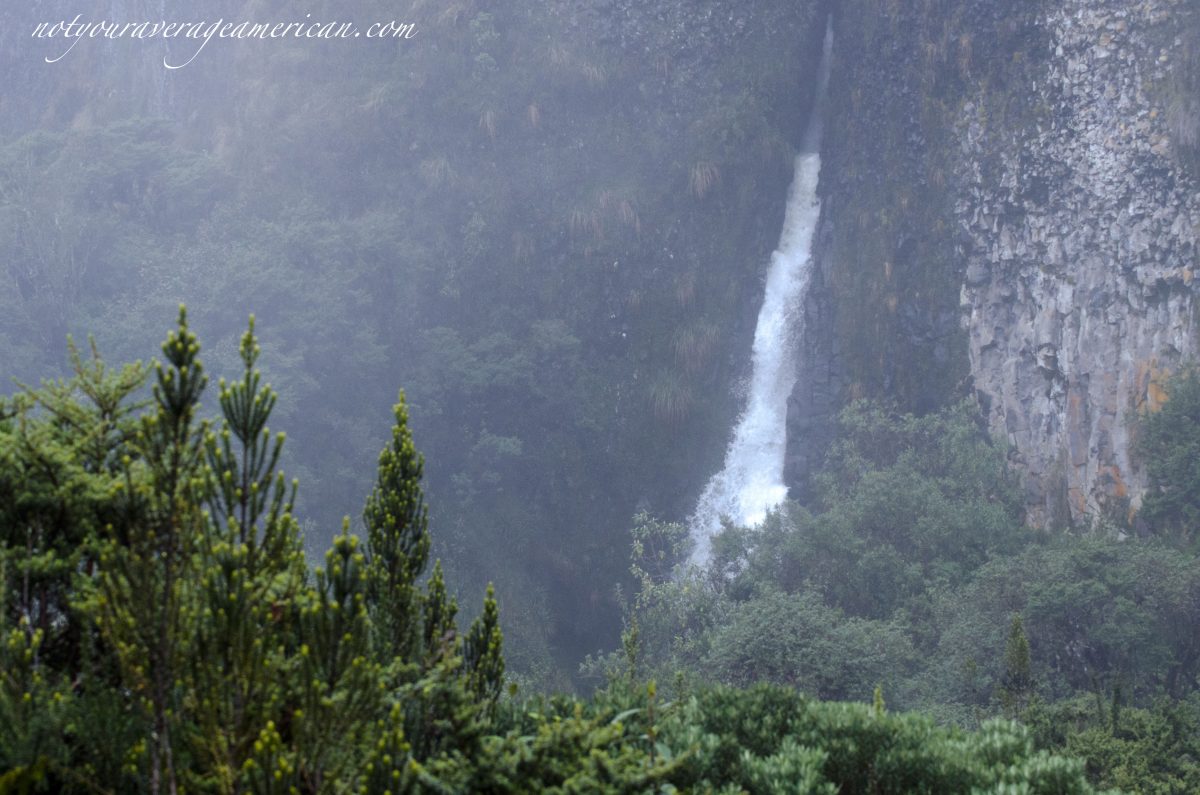 A waterfall gushes from the high mountains in Cayambe Coca National Park, a great place for birdwatching in Papallacta