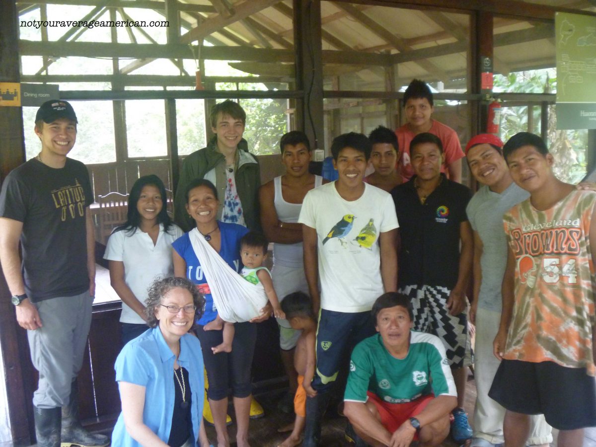 This is a final photo of our stay - myself and sons with the team that helped make us comfortable. Except for us, everyone else in the picture is Huaorani | ©Angela Drake
