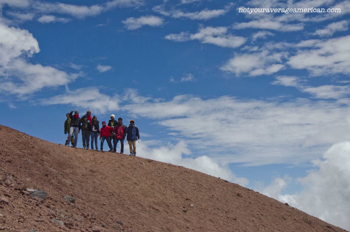 A group of Colombians proudly pose on a ridge, Cotopaxi National Park, Ecuador | ©Angela Drake