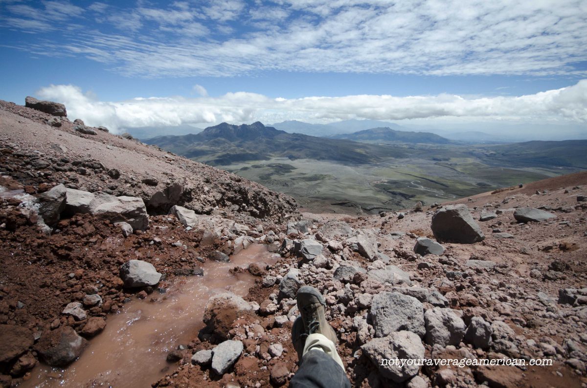 The author sits at the base of the glacier as ice cold water runs by and enjoys the view; Cotopaxi National Park, Ecuador | ©Angela Drake The author sits at the base of the glacier as ice cold water runs by and enjoys the view; Cotopaxi National Park, Ecuador | ©Angela Drake