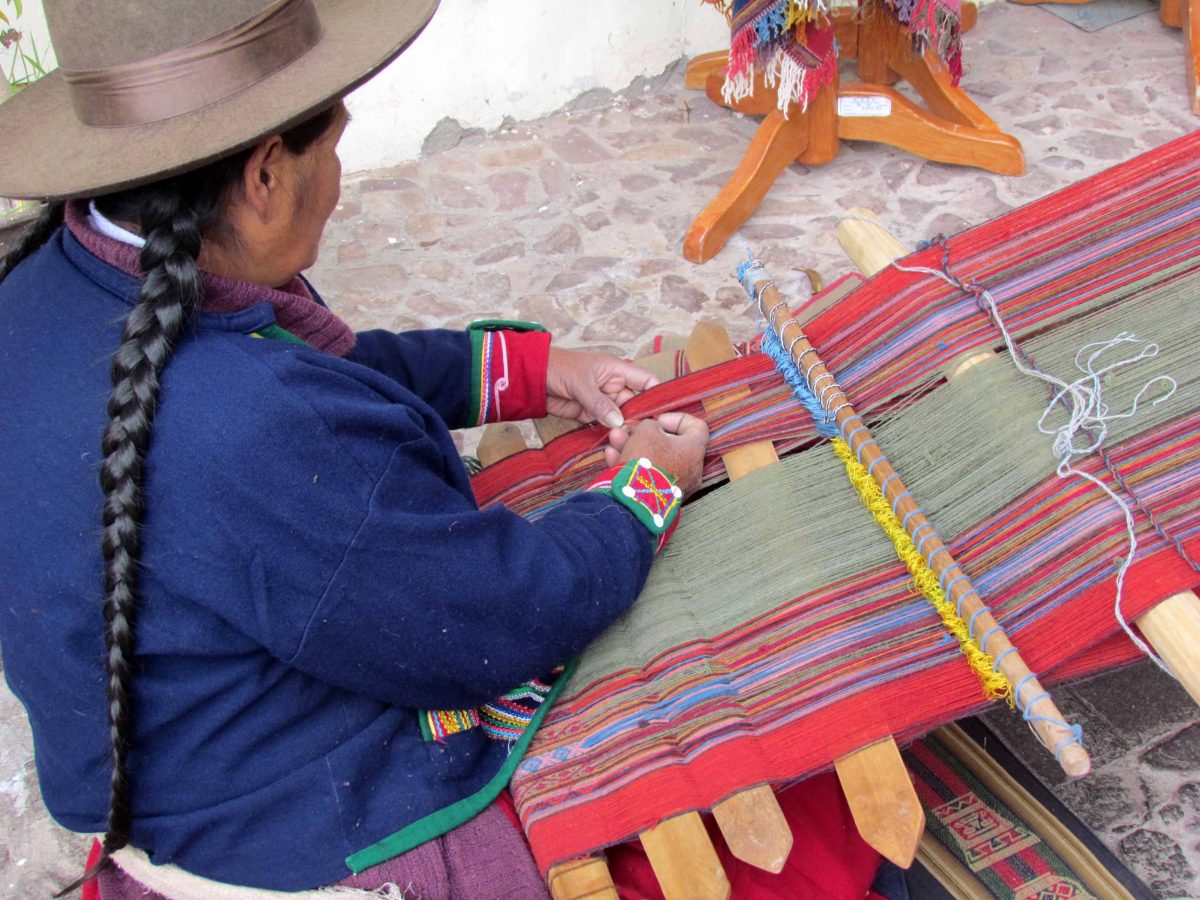 Using a backstrap loom; The Center for Traditional Textiles of Cusco, Peru | ©Angela Drake