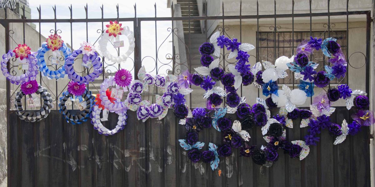 Wreaths of plastic flowers last longer than bouquets, Calderón, Quito, Ecuador | ©Angela Drake