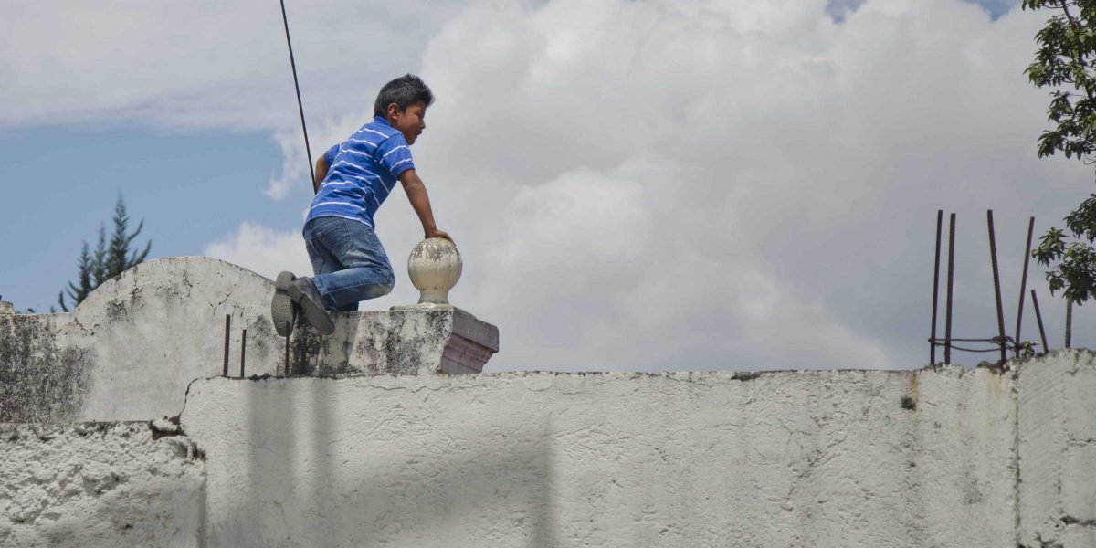 Playing in the Cemetery, Calderón, Quito, Ecuador | ©Angela Drake