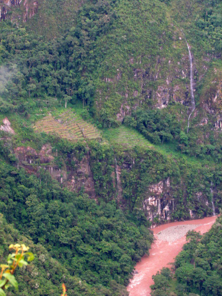 Waterfall, lower terraces of Machu Picchu, and the Rio Urubamba