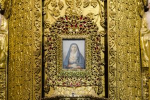 Small painting of the Virgin Mary as La Dolorasa surrounded by gold leaf