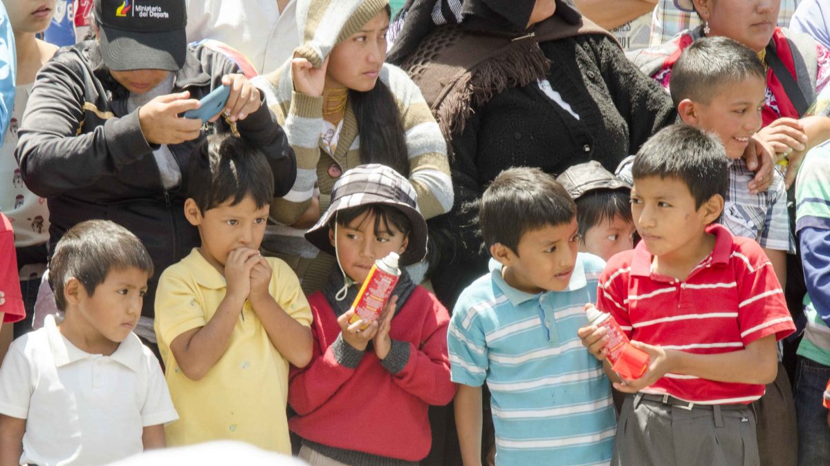 Little Boys with cans of party foam, Carnaval in Guaranda, Ecuador