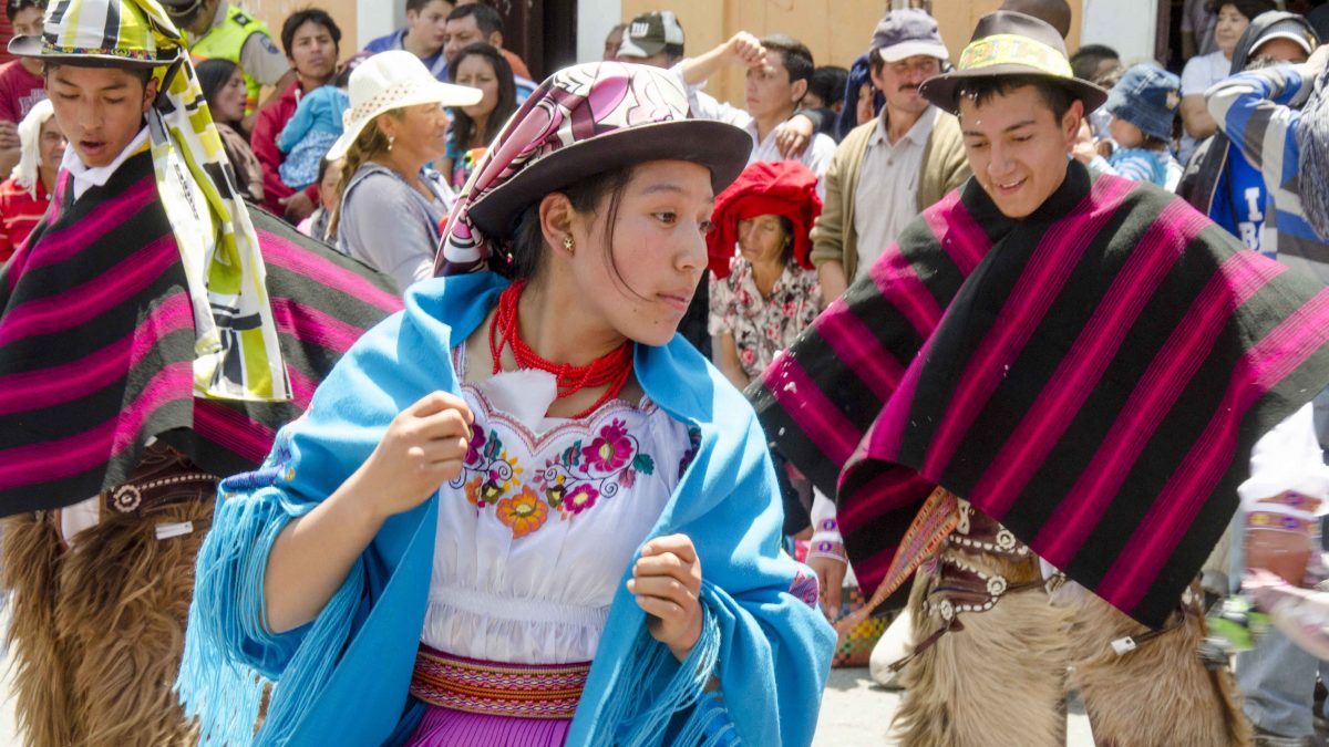 Man and woman dancing in traditional costume, Carnaval in Guaranda, Ecuador