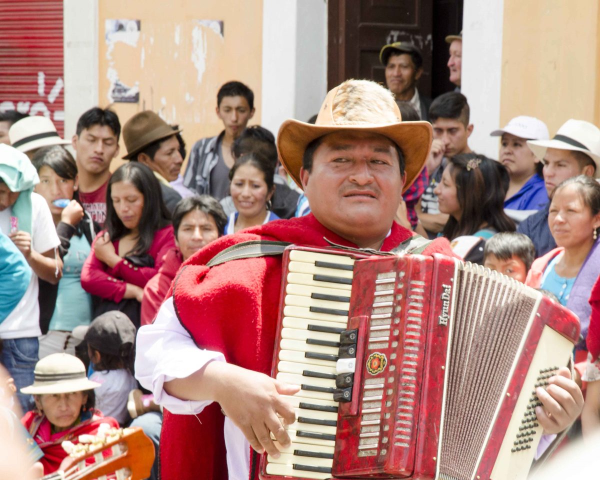 Every parade needs a good accordion player, Guaranda, Ecuador | ©Angela Drake Accordion Player, Carnaval in Guaranda, Ecuador