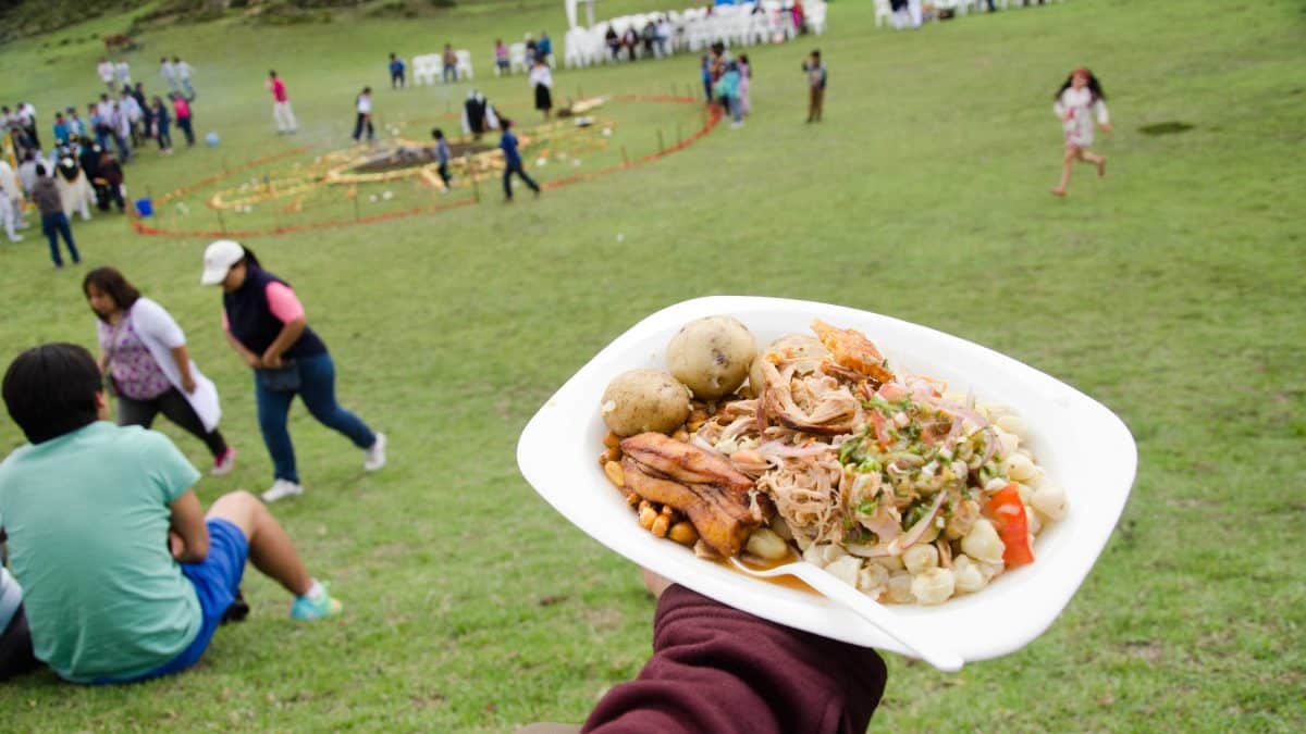 A plate of delicious hornado, Mushak Nina festival, Cochasquí, Ecuador | ©Angela Drake