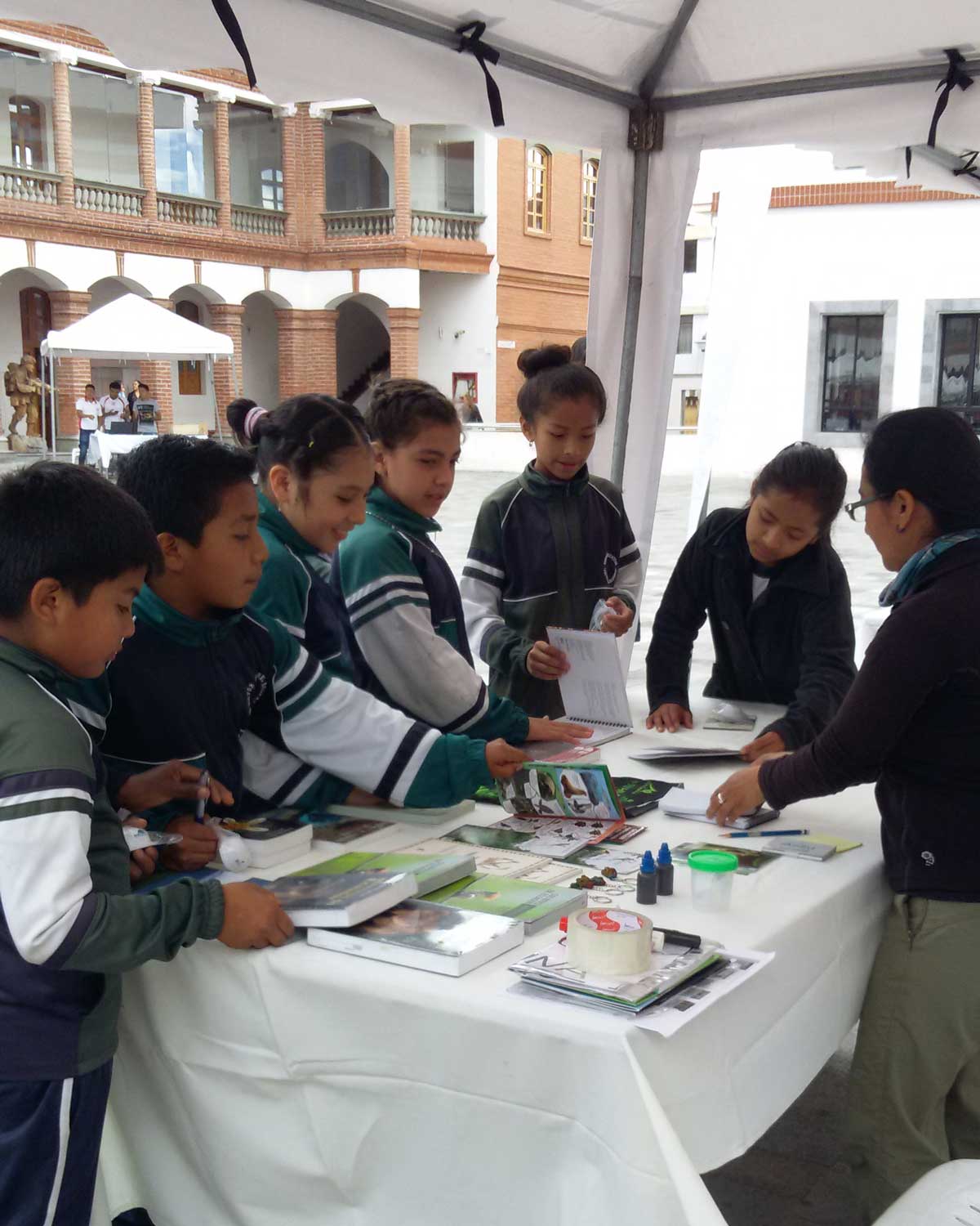 Ecuadorian Children Admiring the Field Guides