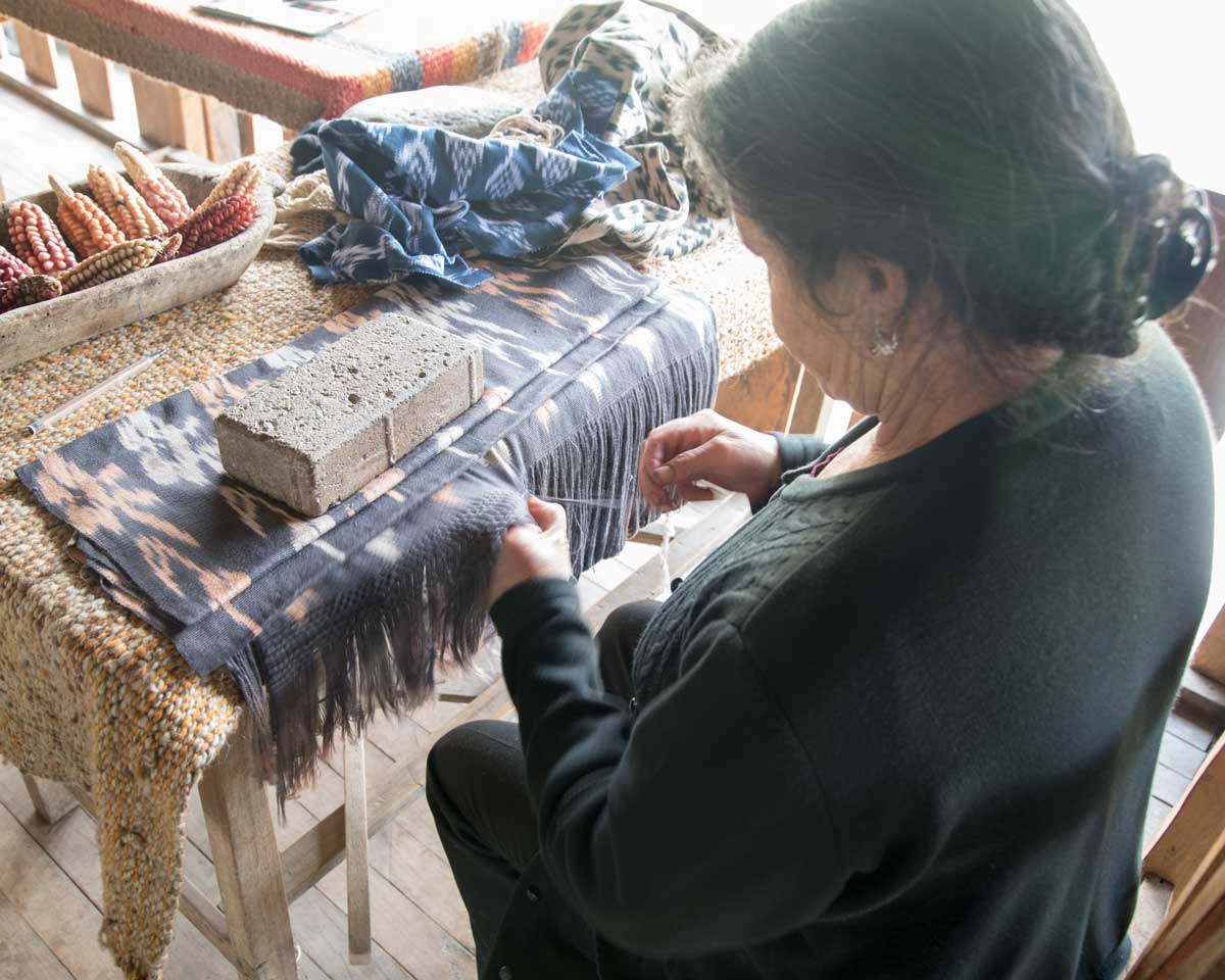 Ana María Ulloa demonstrates hand weaving; La Casa de la Macana, Gualaceo, Ecuador | ©Angela Drake