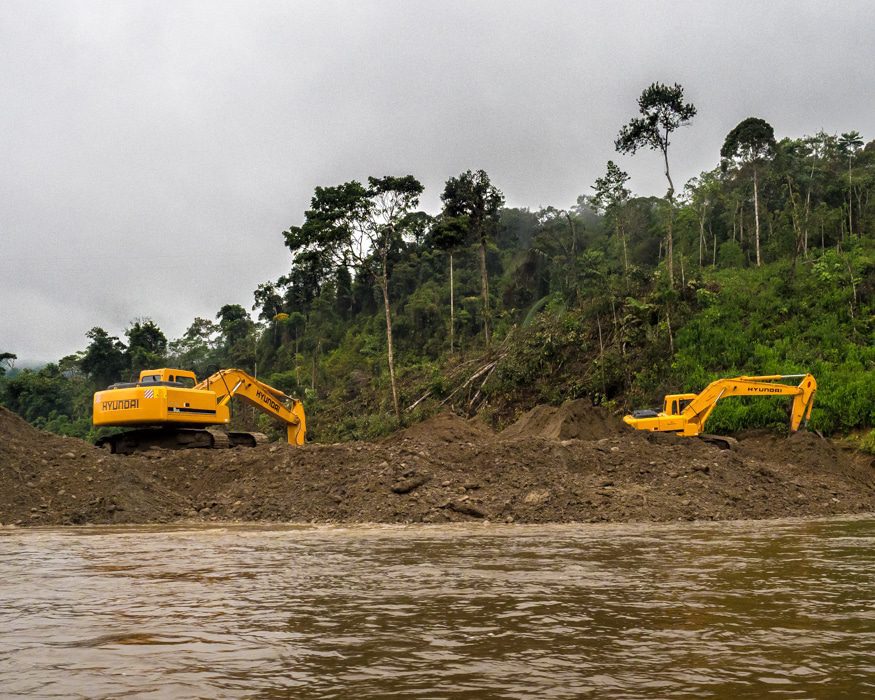 These two machines were changing the course of a quarter mile long stretch of the Nangartiza River. |© Ernest Scott Drake