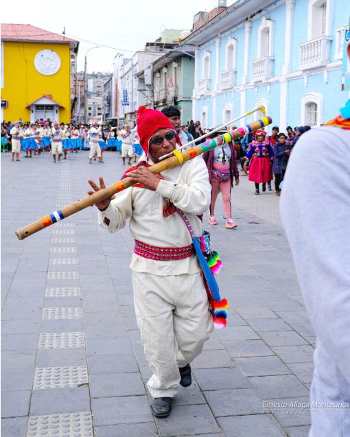 Man playing an ancestral wind instrument