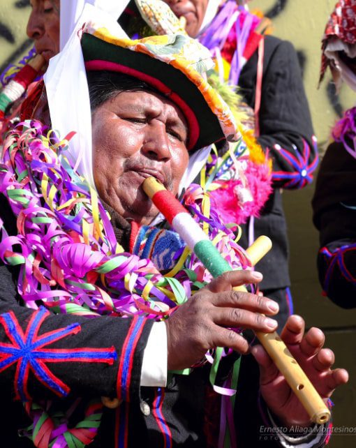 Here playing the pinkillo, ancestral Andean instrument