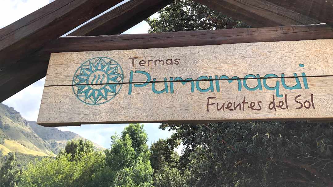 Wooden Sign reading: Termas Pumamaqui, Fuentes del Sol