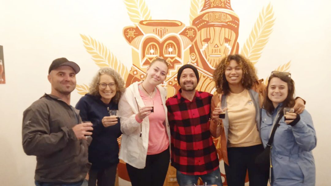 Beer tasting at Viajero Hostel in Quito's Historic Center Guests of Viajero pose with Amerik co-owner, Oscar