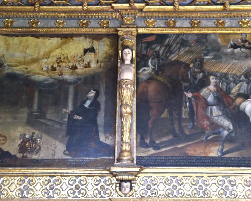 A cherub stands tall between two murals of the Quito School at the San Agustin Church in Historic Quito