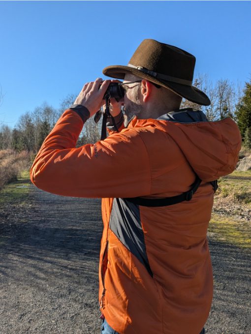 Scott wearing a Craft Sportswear Men's ADV Explore Lightweight Jacket Scott wearing a Craft Sportswear Men's ADV Explore Lightweight Jacket while birdwatching on a sunny day in Oregon
