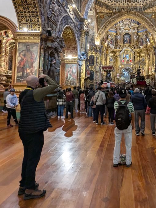 Scott wearing his Craft Sportswear Men's ADV Explore Light Down Vest while photographing Good Friday in Quito's San Francisco Church. Scott wearing his Craft Sportswear Men's ADV Explore Light Down Vest while photographing Good Friday in Quito's San Francisco Church.