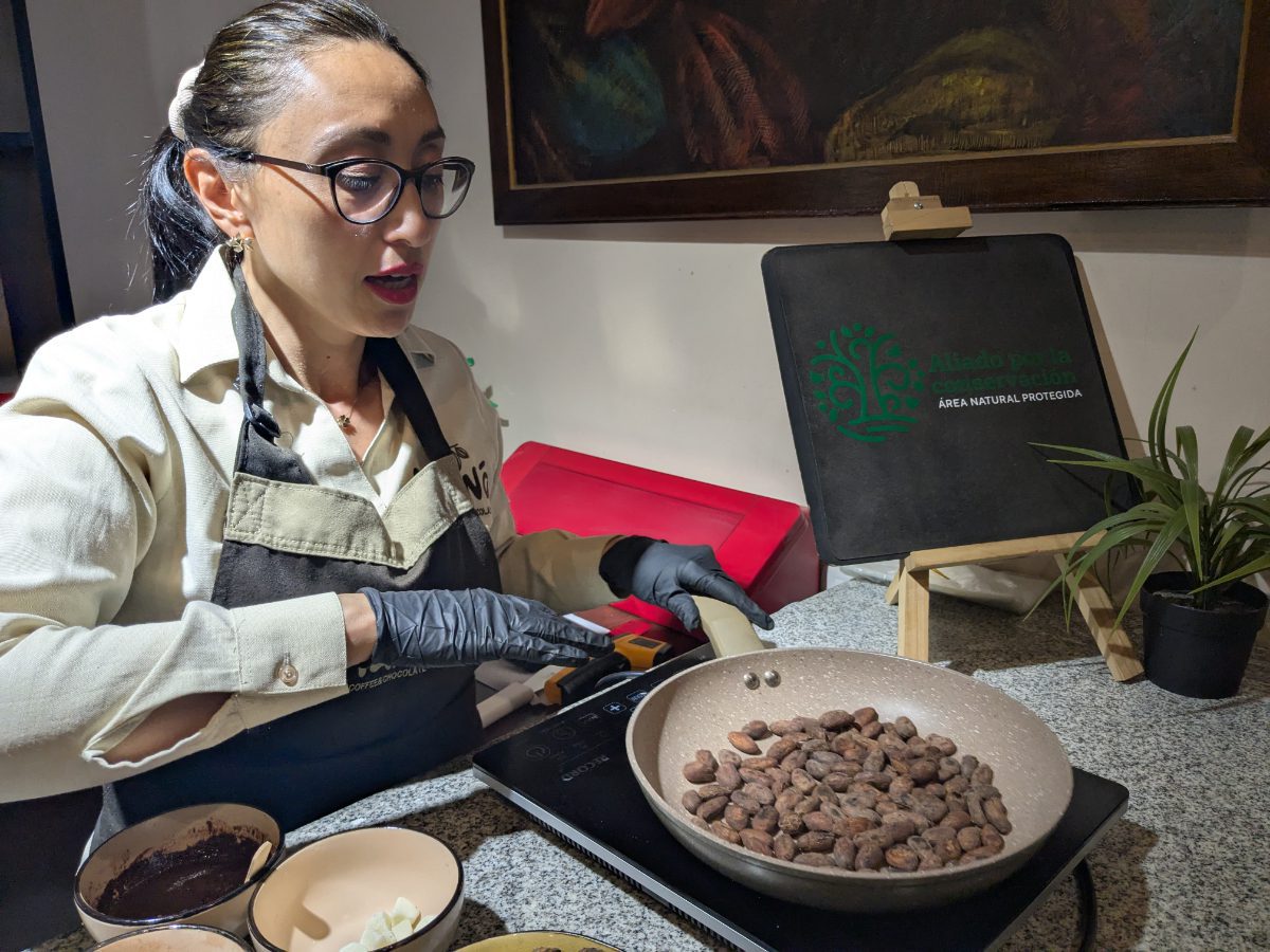 Toasting Cacao Giannini toasts cacao beans in a small pan at Maná Chocolate.