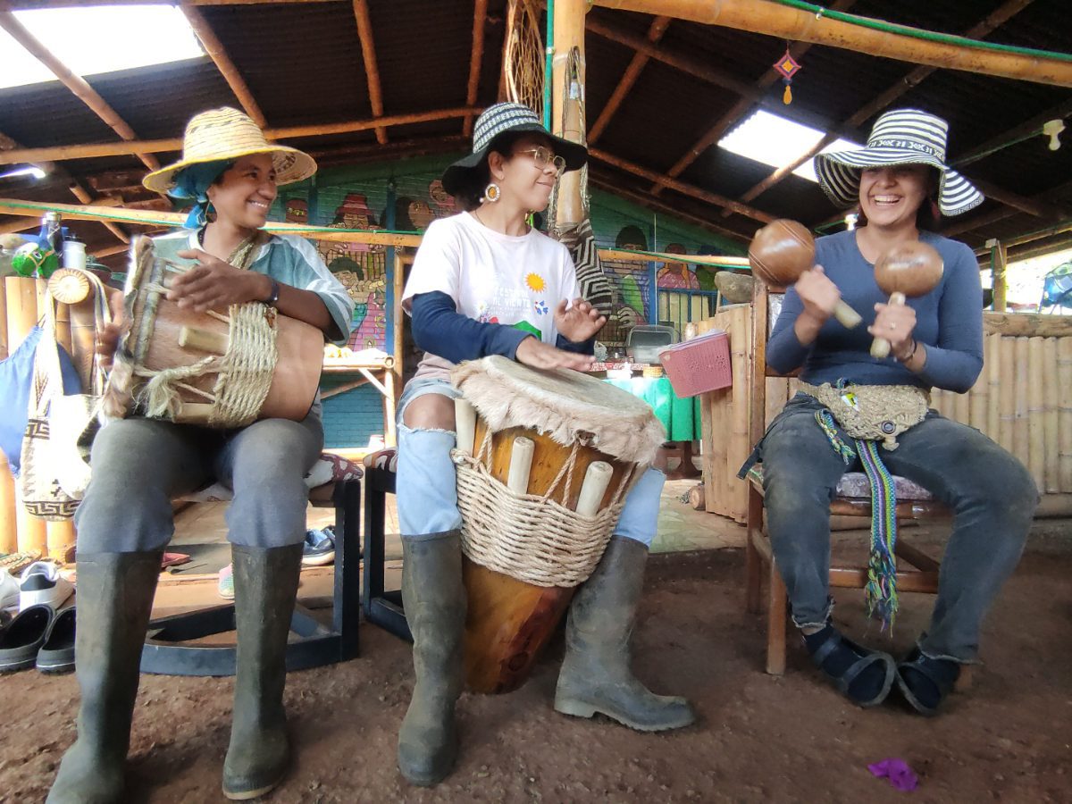 Three women play traditional instruments near Cali, Colombia