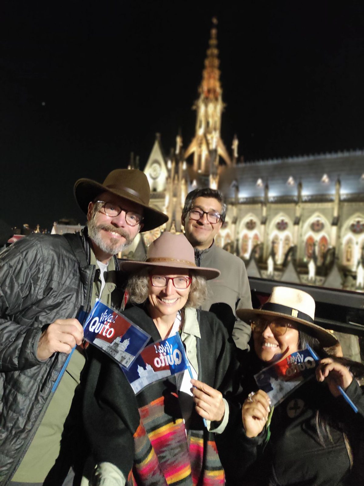 Four friends celebrating the Fiestas de Quito on the Quito Tour Bus