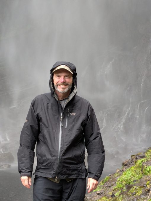 Scott with no altitude sickness smiling in front of the Gocta Waterfall