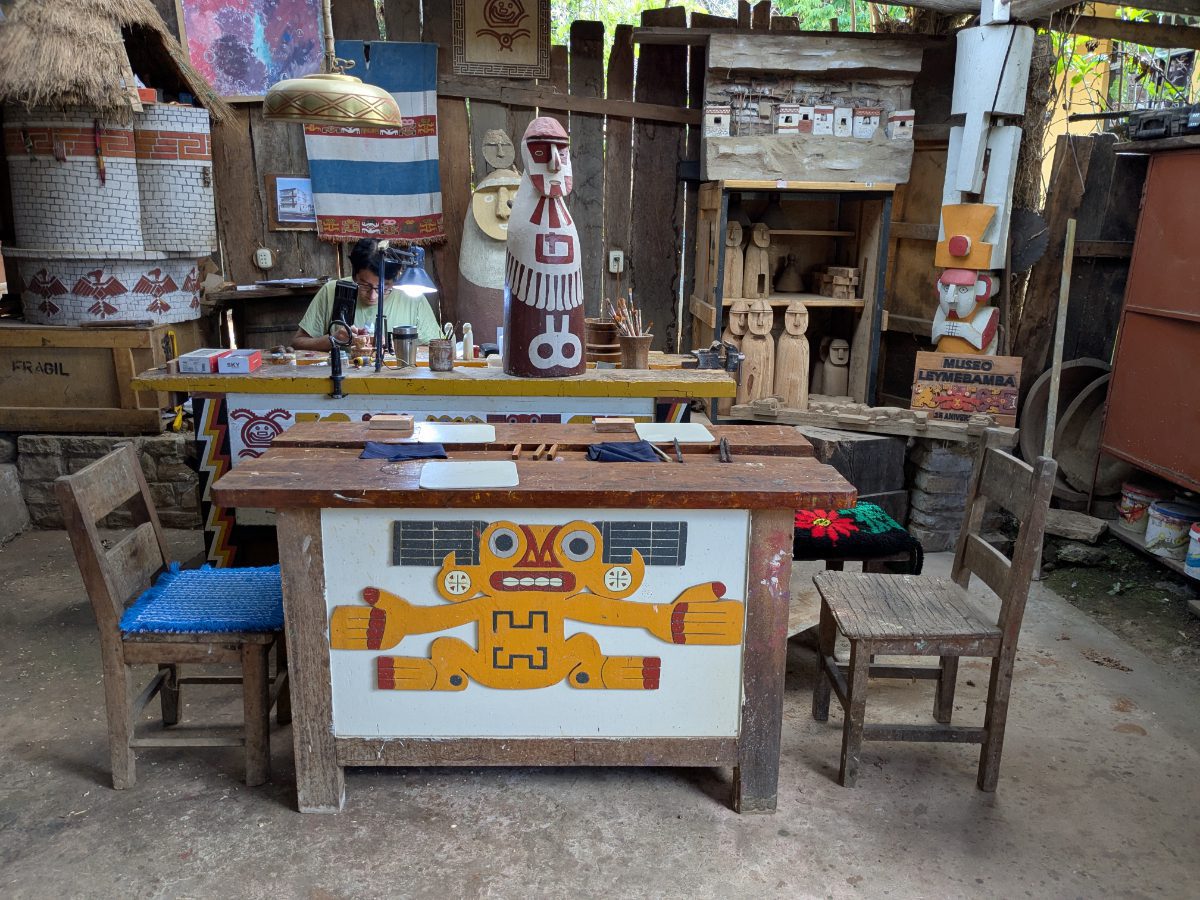 Miguel Huaman prepares for visitors in his workshop full of wooden carvings and Chachapoyan iconography.