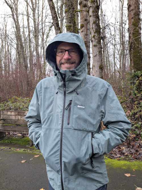 Scott wearing his Stormbird raincoat by Finisterre while hiking at Kelly Point Park.